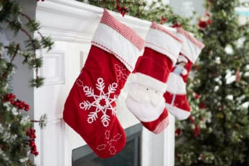 Baby's First Christmas Stocking hanging on the hearth