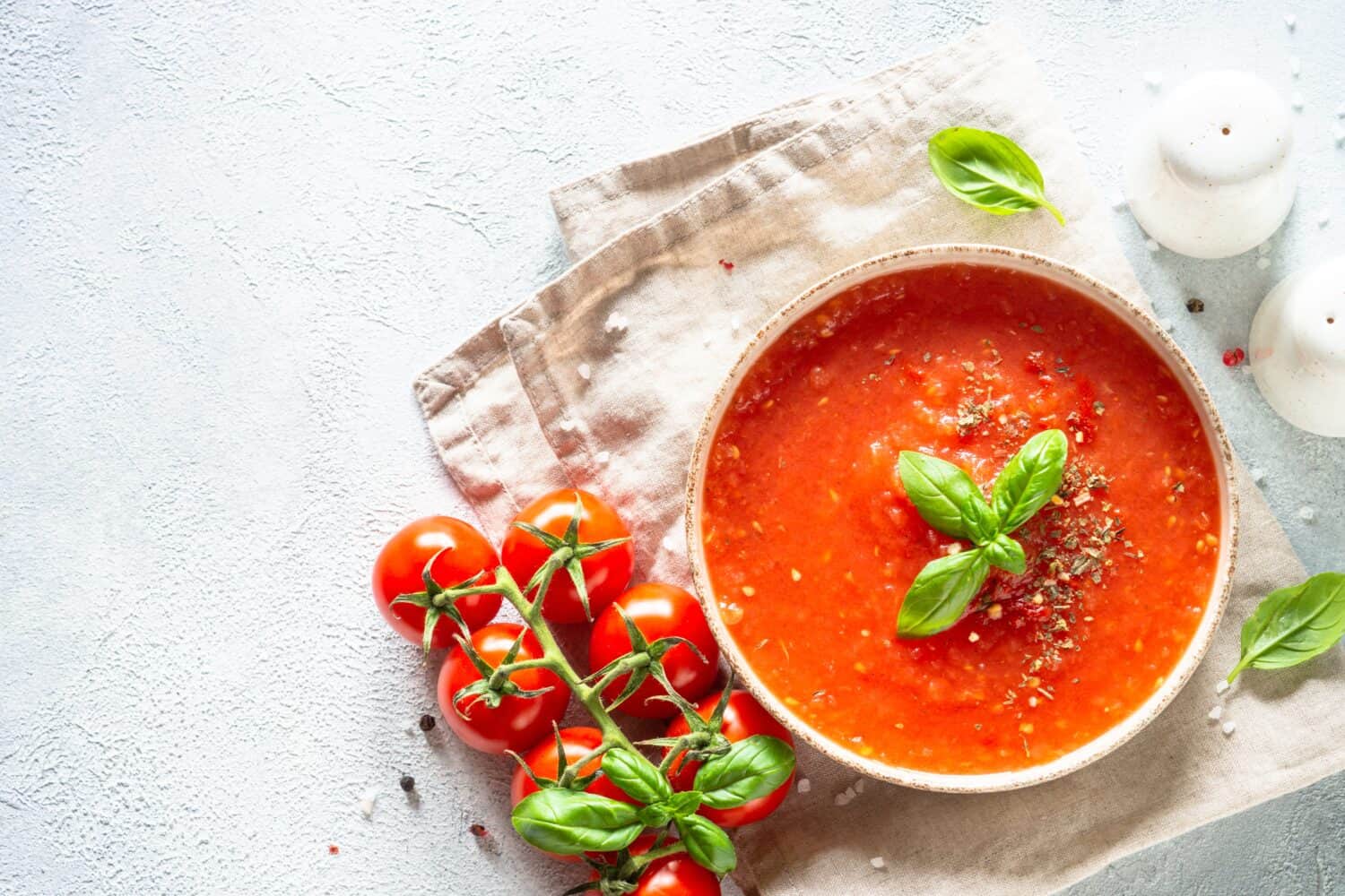 Tomato soup, vegan dish on white.