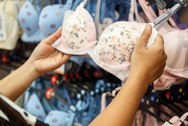 Woman choosing bra in the shop