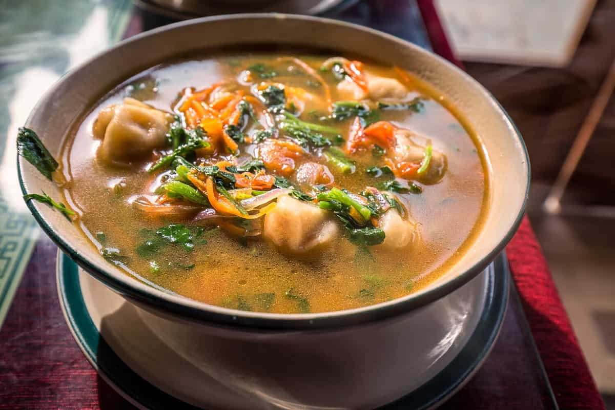 Traditional Tibetan food is momo soup with vegetables Darjeeling, India.